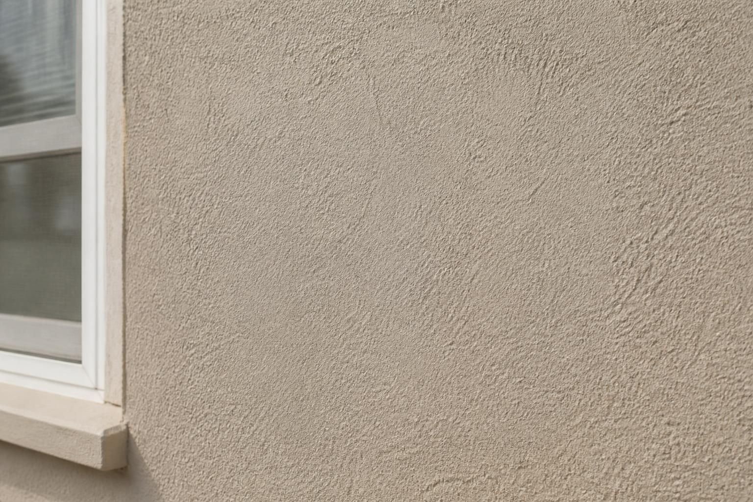Smooth stucco repair with a clean matched exterior texture.